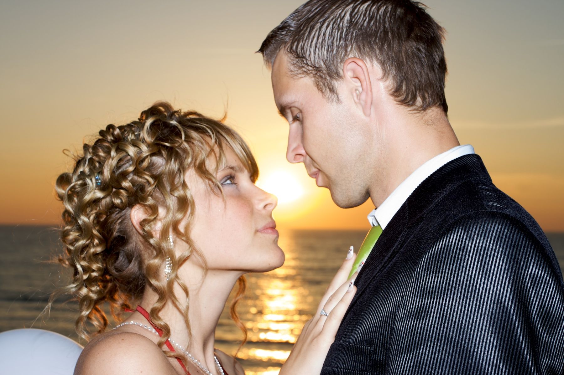 Couple silhouetted at sunset